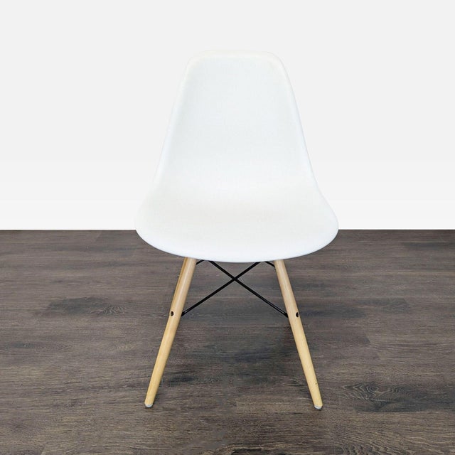 The chairs were designed by Charles and Ray Eames in 1948. The molded plastic chairs consist of clean, simple forms...