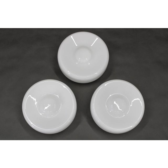 Set of three mid-century flush mount ceiling lights produced in czechoslovakia during the 1970s. Each lamp combines a...