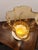 A striking mid-century Venetian art glass vase featuring a warm amber body, a dramatic hand-scalloped ruffled rim, and...