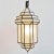 Moroccan white frosted prism lantern with metal frame. Includes 3' chain and black ceiling plate. 100 watt max fixture....