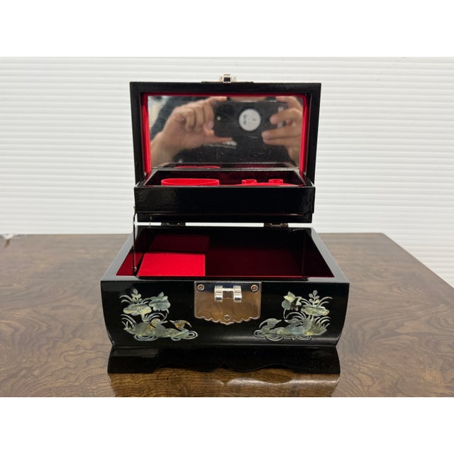 Design Plus Gallery presents a Jewelry Box with Mother of Pearl Inlays. The box on the outside is resplendent with shiny...