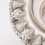 This sterling silver mayim achronim set, crafted in Israel during the 20th century, showcases a beautifully detailed grape...