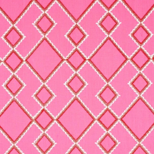 This geometric textile is a play on an argyle and features an embroidered pattern with rickrack-ish edging in a midscale...