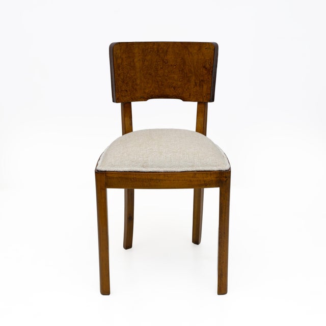 Set of 6 Art Deco dining chairs. Beech frame, with walnut burl veneer on the front of the backrest, while the rear of the...
