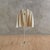 An Italian valet from the 1970s, crafted in clear plexiglass with polished brass fittings. The silhouettea hanger poised...