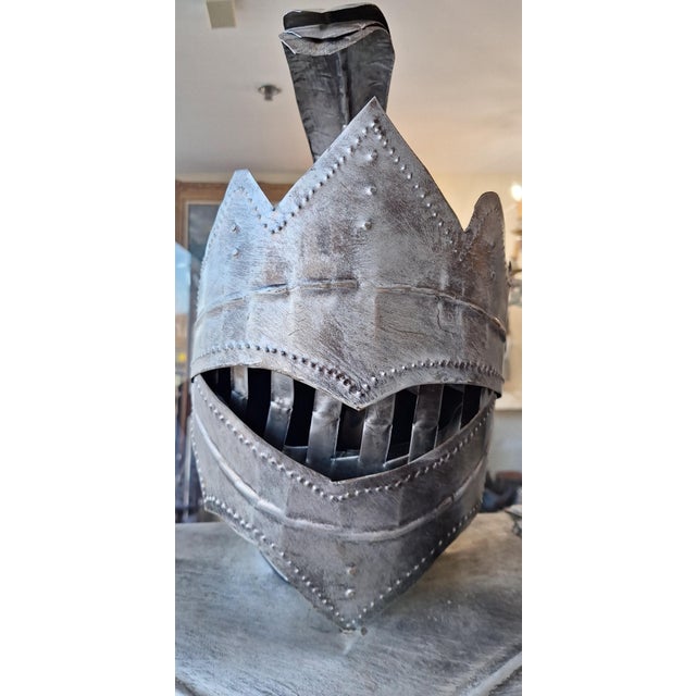 It is in great condition and appears to be signed on the right metal glove. it meaures 81'' h. The base measures 18 1/2''...