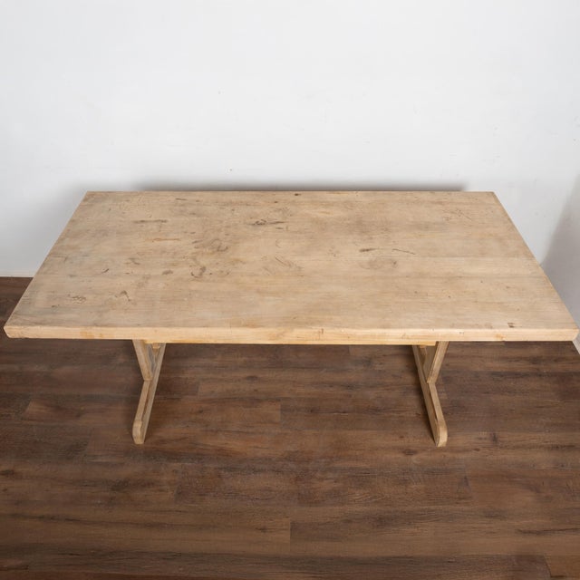 19th Century Rustic Farmhouse Trestle Dining Table 19th-century farmhouse trestle dining table crafted in hardwood with a...