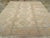 An antique Turkish Oushak room size carpet. Several versions of the foliate lozenge design (Yaprak) are arranged in three...