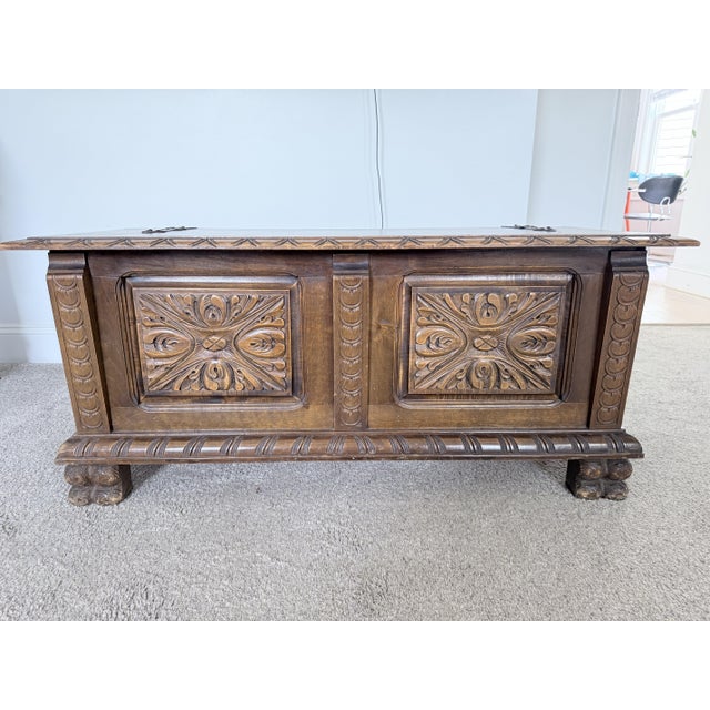 A carved Renaissance style replica with oak blanket chest (cassone), purchased in the early 1930s, with bold and exuberant...