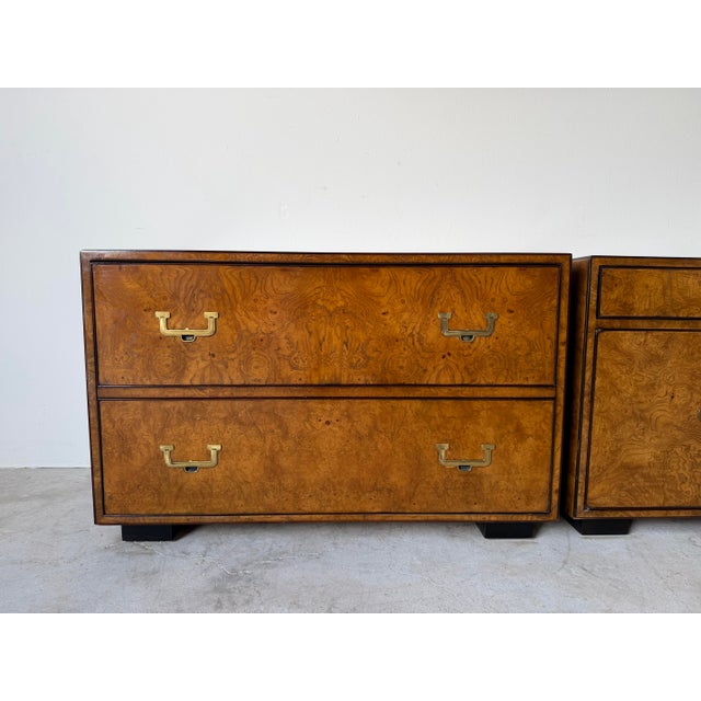 Elegant and timeless, this pair of vintage John Widdicomb nightstands showcases beautifully figured burl wood veneer with...