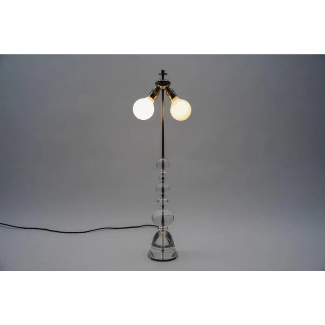 The lamp requires two e27 / e26 edison screw bulb, is wired, functional and runs on both 110 / 230 volts. our lamps are...