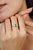 This dainty ring is crafted in 925 sterling silver, featuring a vivid octagon cut emerald accented by six sparkling round...