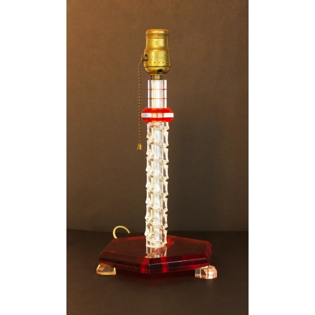Funky 1950's acrylic/lucite table lamp in ruby red and clear in a helix pattern. Works, but rewiring is recommended. 16.5"...