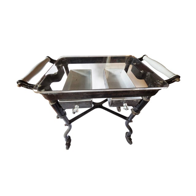 During World War II, this rugged heavy-duty rolling table was used for manufacturing and assembling parts. Discovered in...