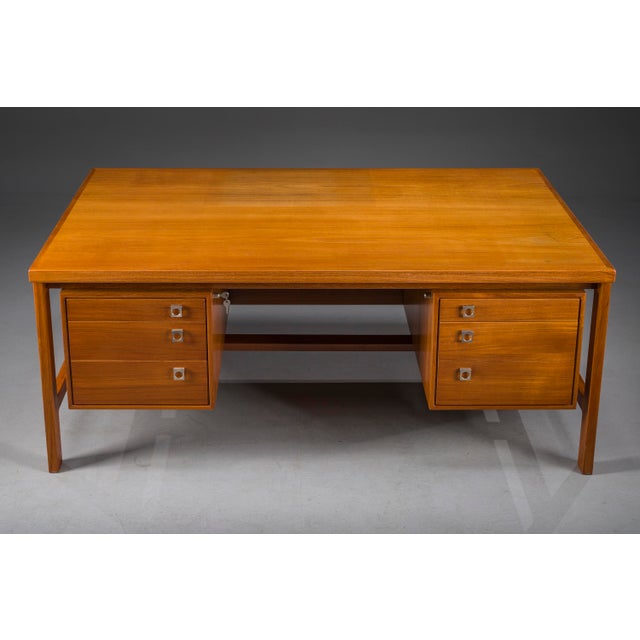 Classic danish modern executive desk designed by arne vodder for h.p. Hansen, 1960s. Crafted in warm teak, it features...