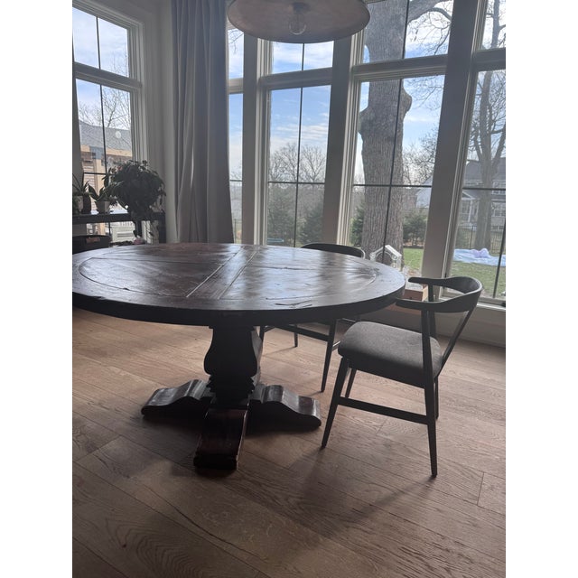 This is the table that anchored everything. A Restoration Hardware Salvaged Wood Trestle Round Dining Table substantial,...
