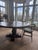 This is the table that anchored everything. A Restoration Hardware Salvaged Wood Trestle Round Dining Table substantial,...
