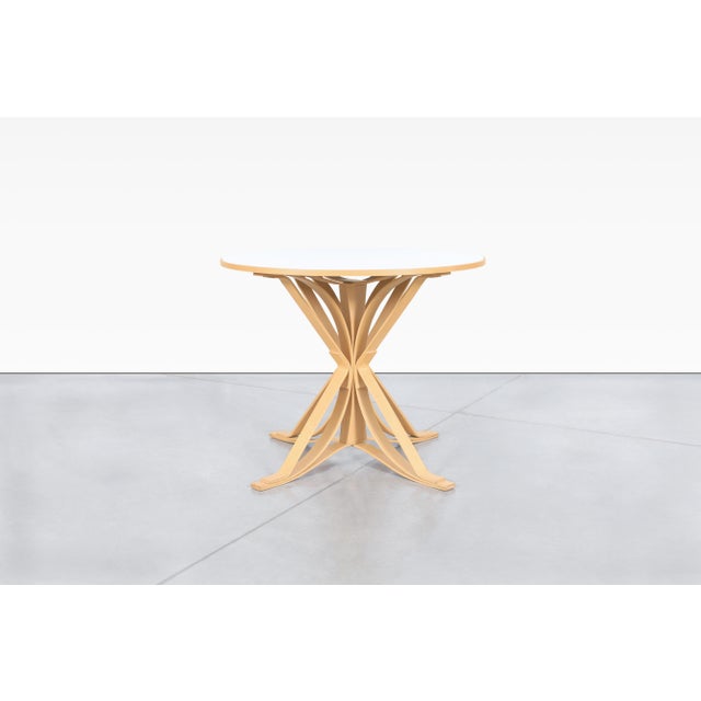 The Hat Trick dining table by Frank Gehry for Knoll International, exemplifies the architect’s signature playful and...
