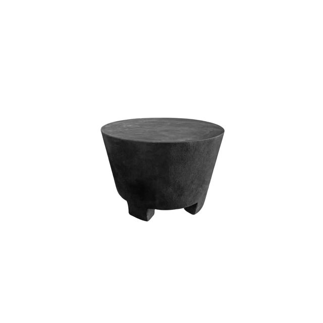 A wonderfully sculptural round side table. Its neutral pigments make it perfect for any space. A uniquely sculptural and...