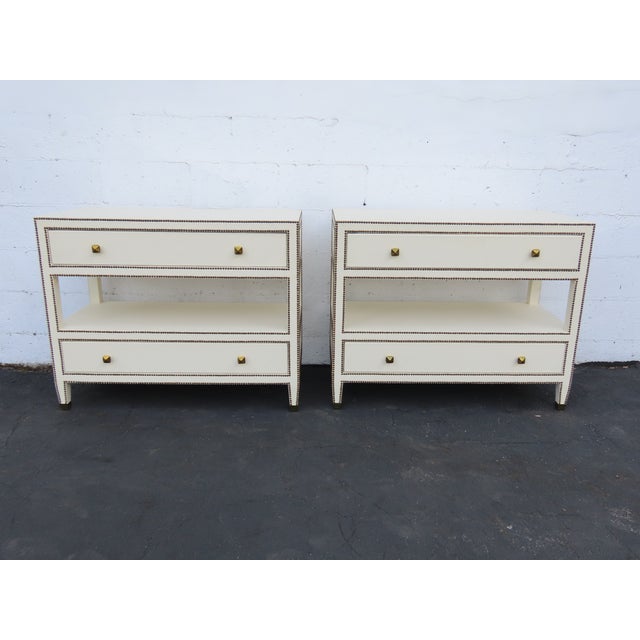 This Pair of Nightstands is made of wood, bonded leather, and metal. This Pair of Nightstands is an excellent example of...