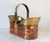 Vintage copper and brass basket with lion head motif and movable handle. No makers mark. Some age wear. Patina. Small dents.