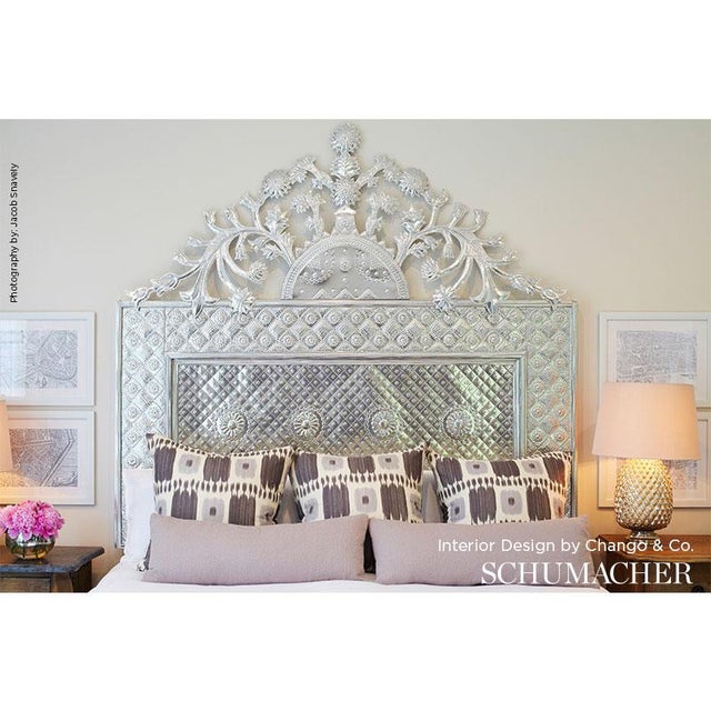 Kandira features a graphic pattern derived from woven ikats. A painterly checkerboard design with tonal variations and a...