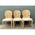 This set of six vintage dining chairs showcases a striking sculptural silhouette, each backrest carved to resemble the...