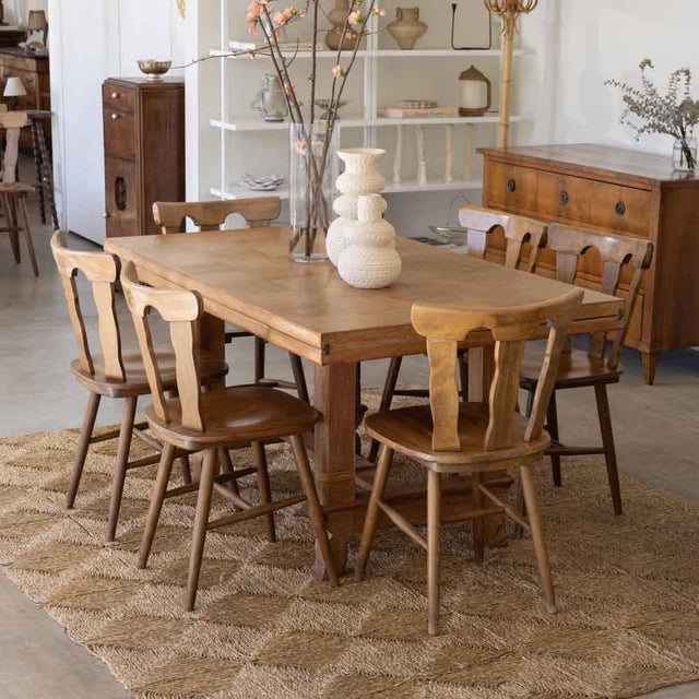 Beautiful set of 8 wood mountain chairs from France, 1950s. Brutalist style with carved wood back with three wide slates....