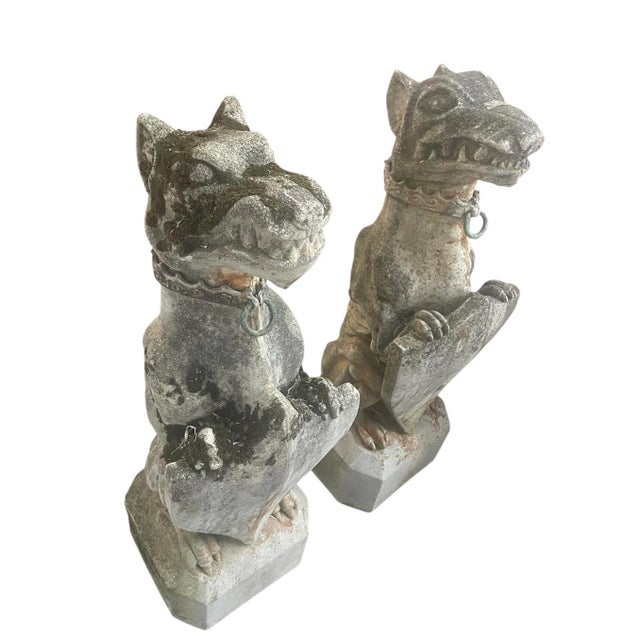 An impressive pair of Gothic Revival seated grotesques. Expertly crafted from heavy cast stone, these figures feature a...