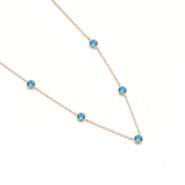 Add a refreshing pop of color to your neckline with this elegant station necklace. Designed for effortless style, this...