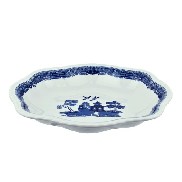 Elevate your dining experience with this Blue Willow Design serving bowl by Johnson Brothers. Crafted with timeless...