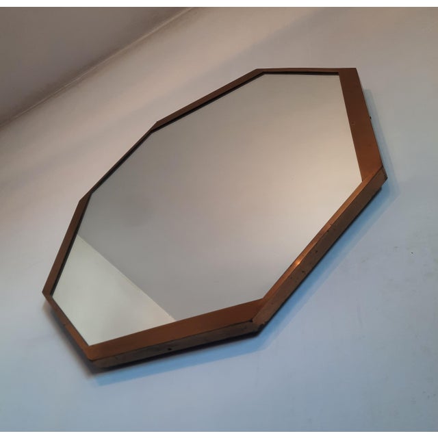Large and beautiful octagonal brass wall mirror from the mid-century. Great design of high quality. Italian manufacture.