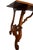 This 19th-century walnut table has stunning lyre legs. The piece is sturdy and could work as a console table or desk.