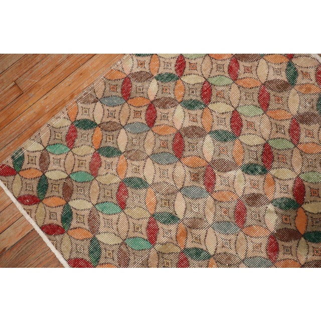 Small square size Turkish deco rug with a repetitive circular motif throughout in array of colors. Measures: 3'7'' x 4'.