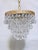 Infuse your home with a captivating layer of romance, warmth, and mid-century shimmer with this exquisite vintage crystal...