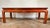 Nice rectangular Chinese red lacquer coffee table. The legs are straight. The top is decorated with branches, flowers and...