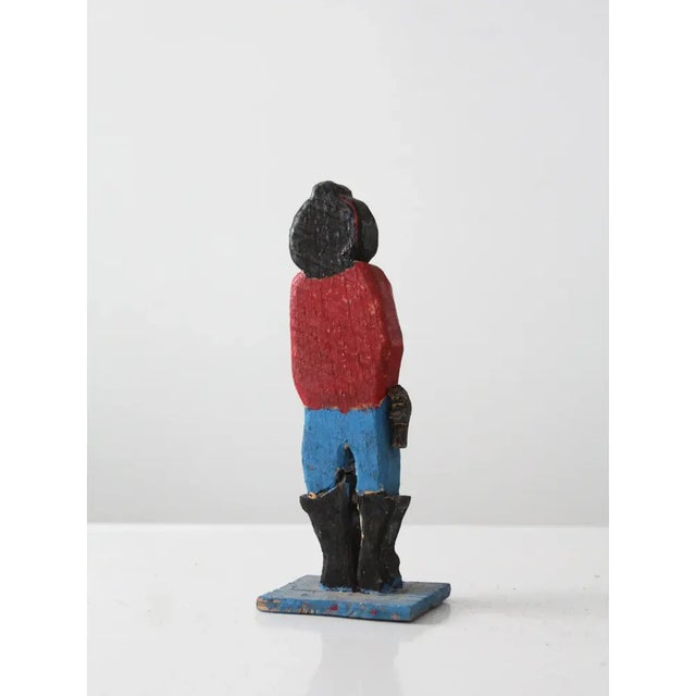 Add a touch of Western charm with this handcrafted wood cowboy figurine, a characterful piece of vintage folk art...