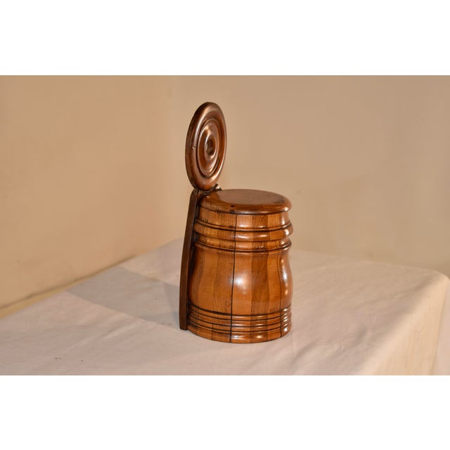 19th century turned sycamore and mahogany salt box from England. The top of the box has a wonderfully turned back portion...