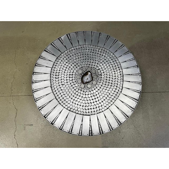 Rare vintage coffee table made of inlaid aluminum mosaic parts, enhanced with resin and with a central inlaid agate stone...