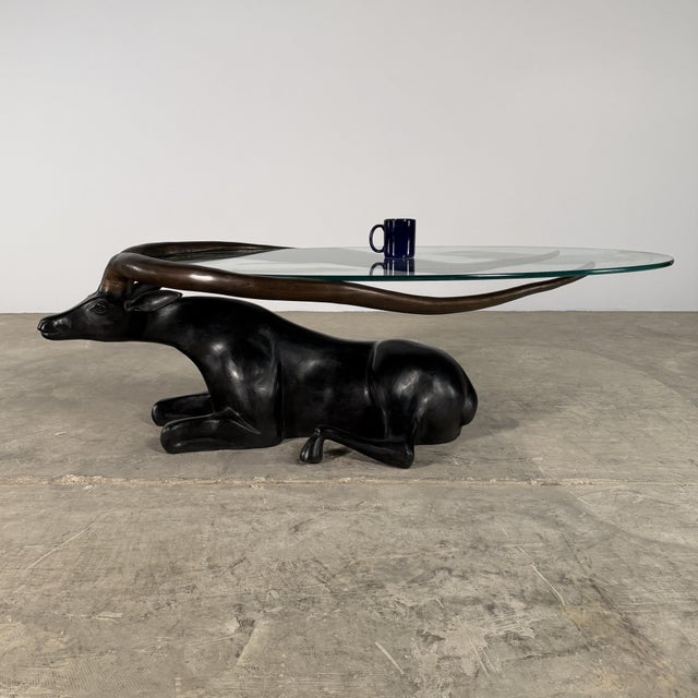 A striking blend of sculpture and function, this bronze antelope coffee table transforms a powerful natural form into a...