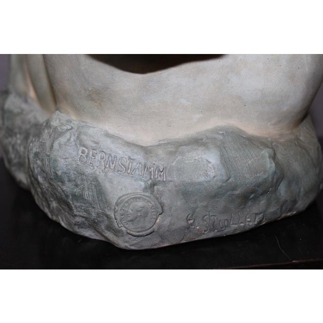 Important Art Nouveau bust of a young woman with a rose in ceramic with a blue-green patina , signed Bernstamm for Léopold...