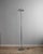 This tall mid-century lamp combines functionality with timeless industrial design. The height-adjustable and rotatable...