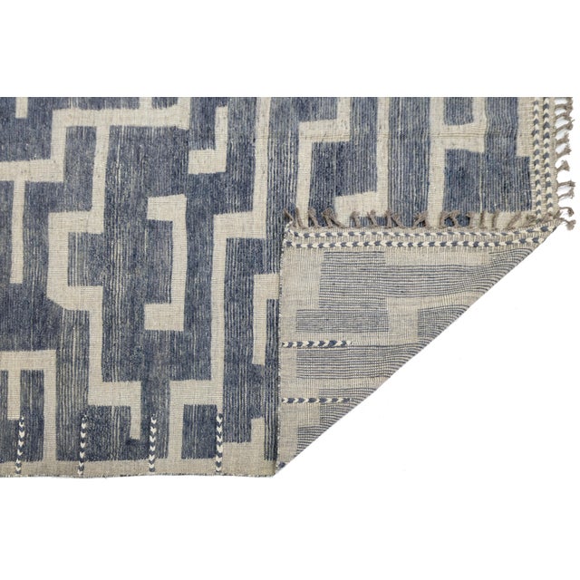 Elevate your space with this stunning Modern Moroccan Style area rug, meticulously handmade from 100% premium wool....