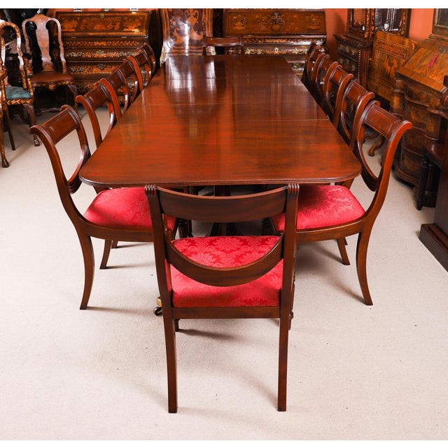 This is a fabulous Vintage Regency Revival triple pillar dining table by the master cabinet maker William Tillman with...