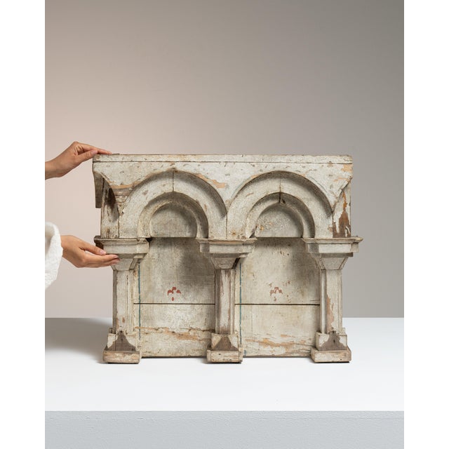 This early 19th century Neoclassical decorative object from France is finished in antique white, worked in wood. Its...