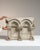 This early 19th century Neoclassical decorative object from France is finished in antique white, worked in wood. Its...