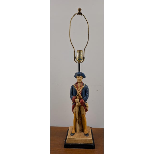 Add a strike of mid-century Americana to your interior with this exceptional vintage 1960s Colonial soldier table lamp....