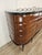 An elegant and refined Italian sideboard from the 1940s, attributed to Vittorio Dassi, an expression of the elegant...