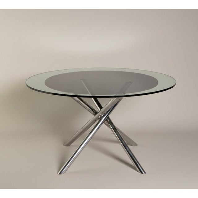 The "Nodo" glass table is an iconic creation by Italian designer Carlo Bartoli for the company Tisettanta, originally...