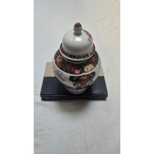 Add a touch of vibrant Chinoiserie elegance to your home with this stunning vintage Japanese porcelain "Royal Peacock"...